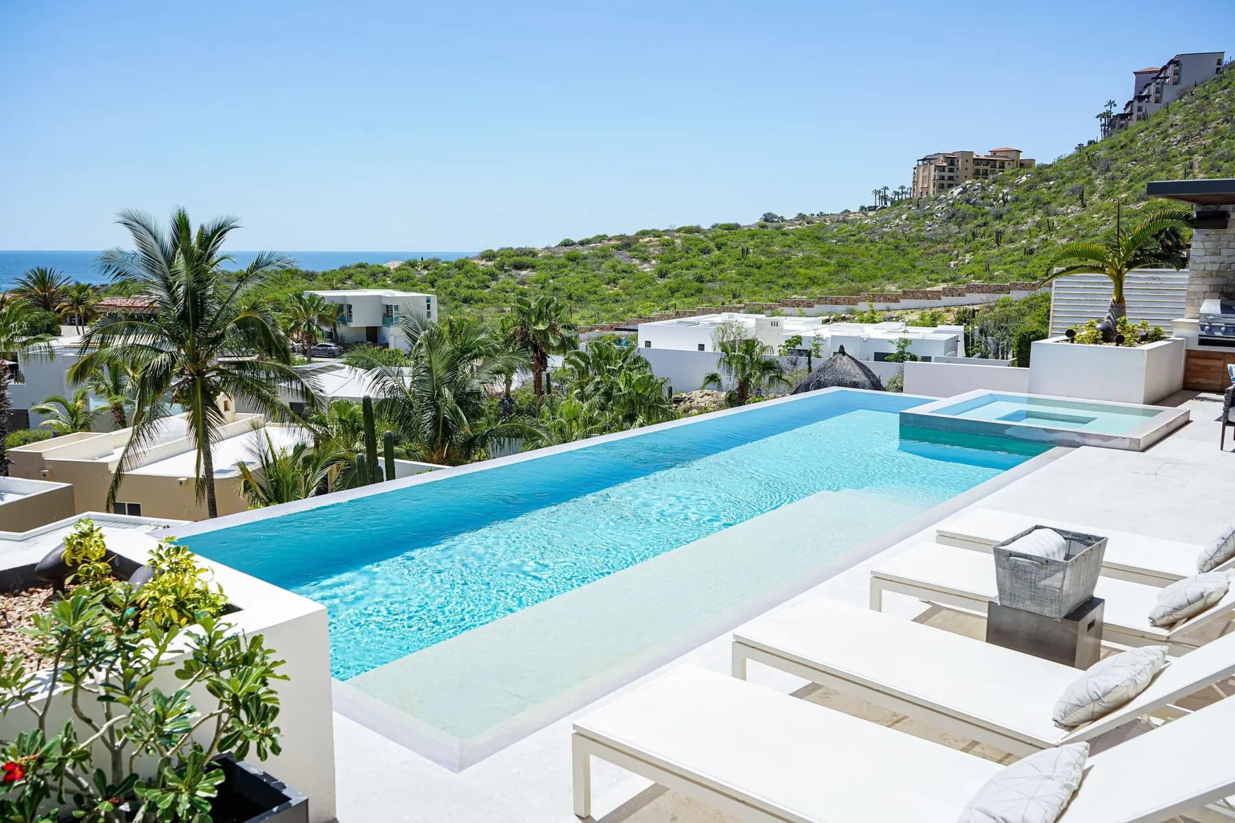 Casa Texas, Pedregal, Cabo San Lucas — infinity pool, patio, and hillside villas